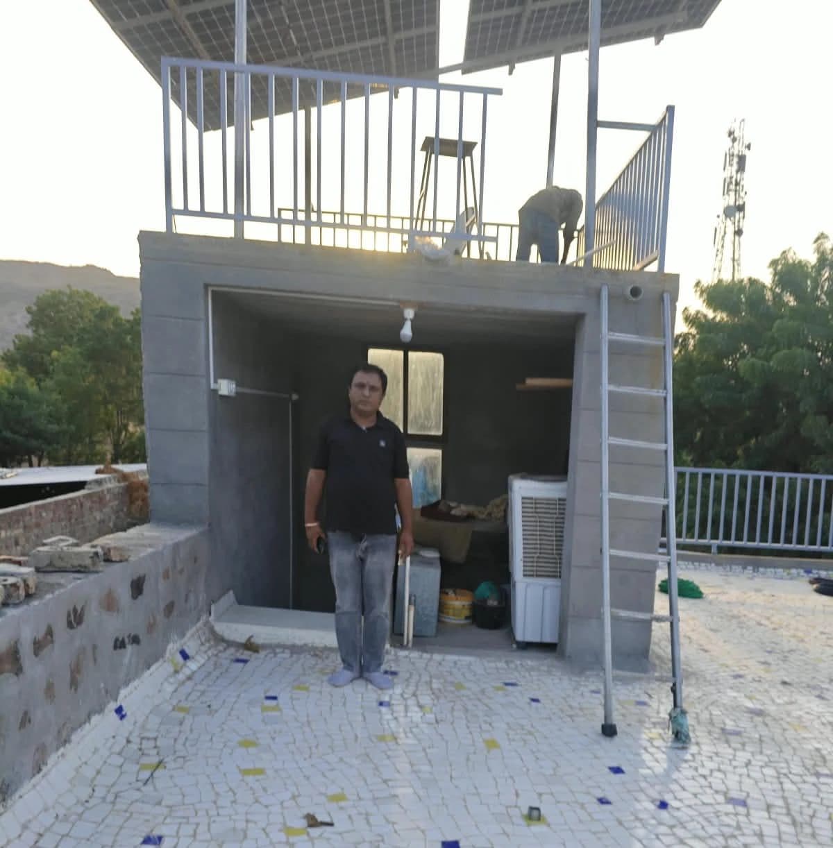 Rooftop structure with steel railing by Balaji Solar & Steel Fabrication in Samdari